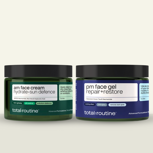 Two jars of face cream labeled "am" and "pm" for day and night skincare routine.