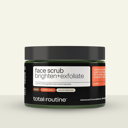Container of "total:routine" men's face scrub to brighten and exfoliate.